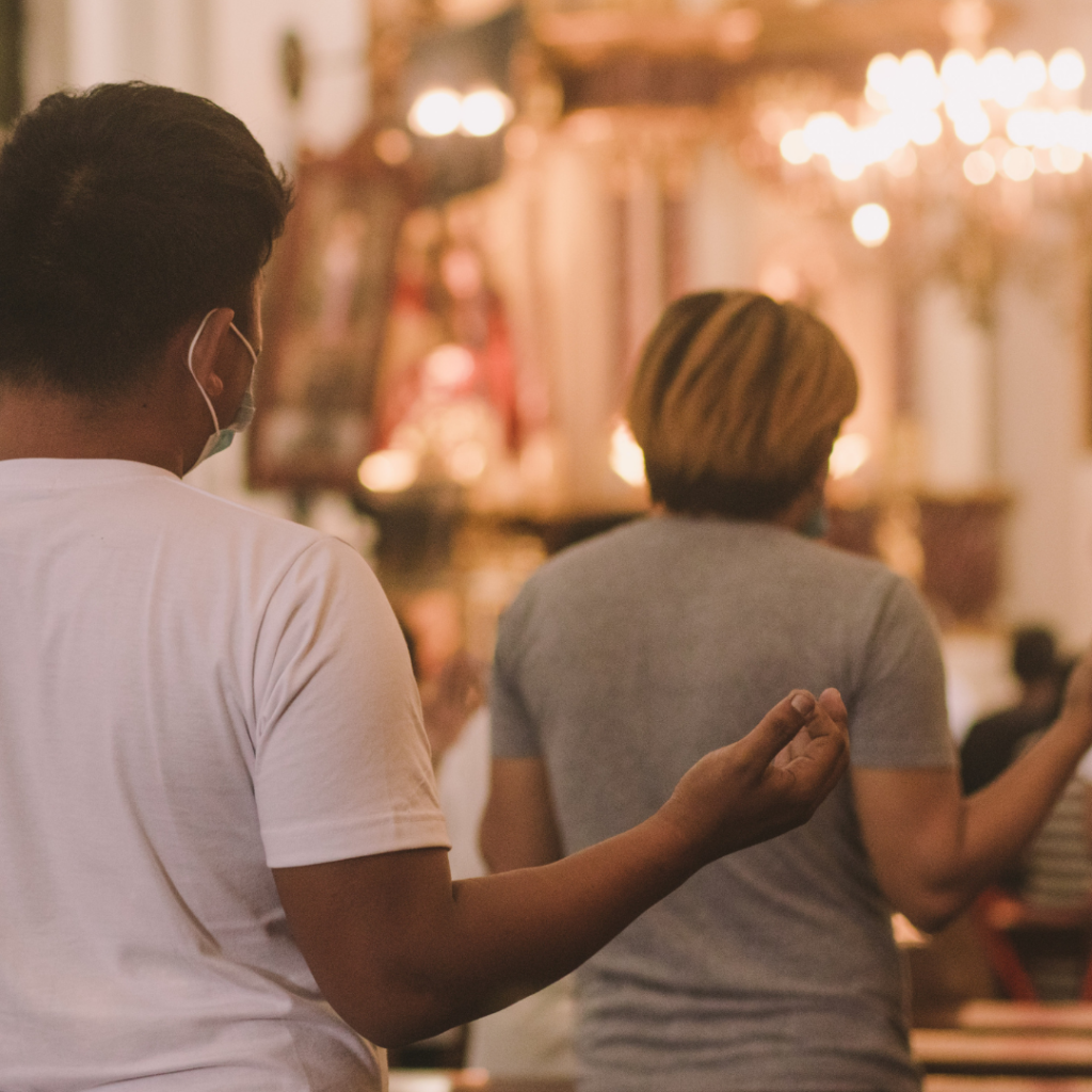 people worshipping in church